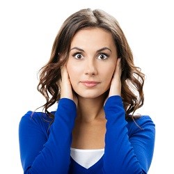 Woman covering with hands her ears, isolated